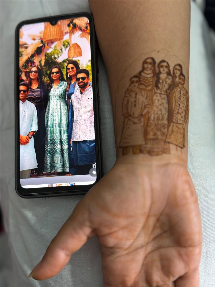 Five-member family portrait recreated in henna